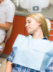 Woman asleep in the dental chair