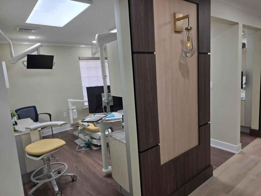 Treatment room with a dental chair, seen from the doorway