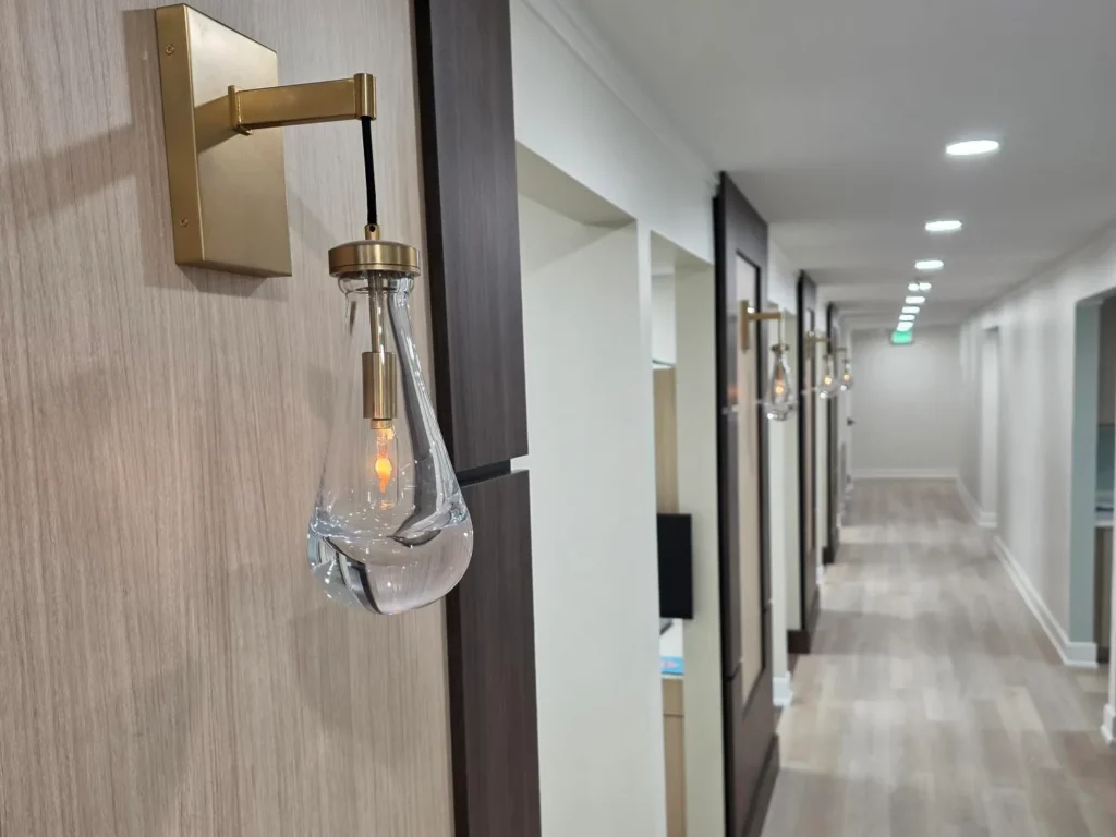 Glass pendant sconce in the treatment-room hallway