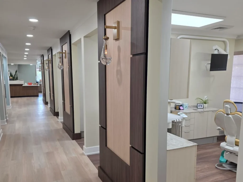 Hallway with an open treatment room on the right